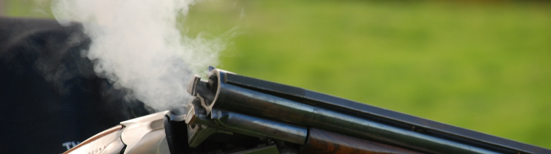 Flightline Sporting shotgun breaking releasing smoke