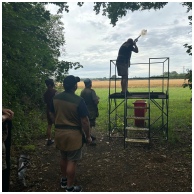Flightline Sporting Man shooting a shotgun from a platform